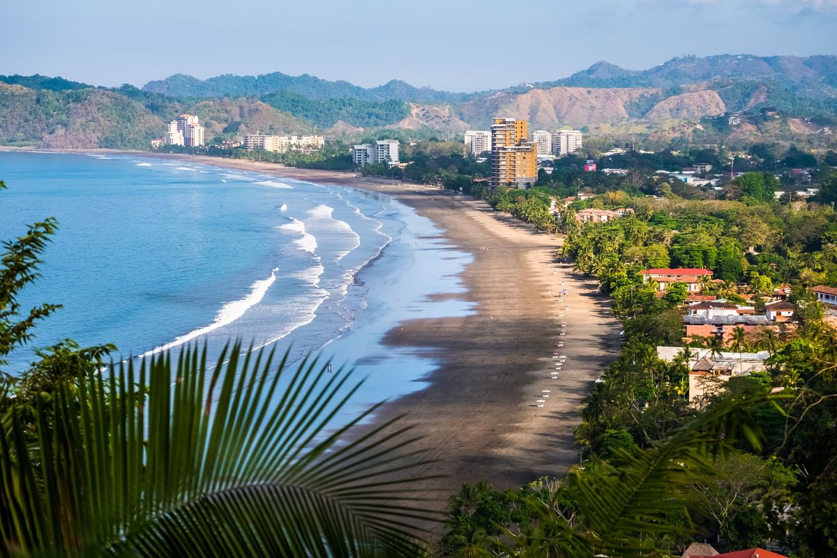 The wide sandy beach at Jacó
